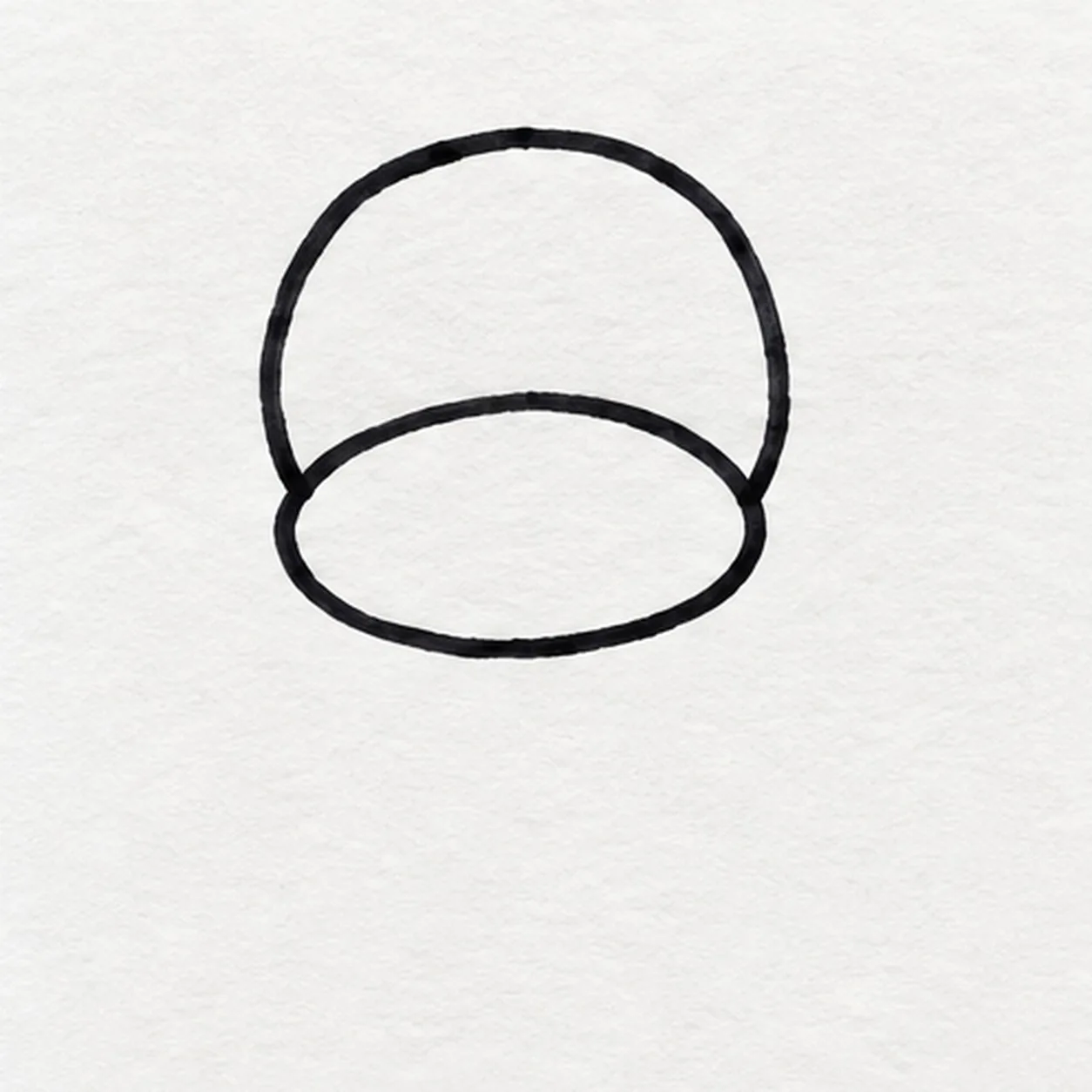 Shape the monkey face stage for how to draw a cartoon monkey with a banana